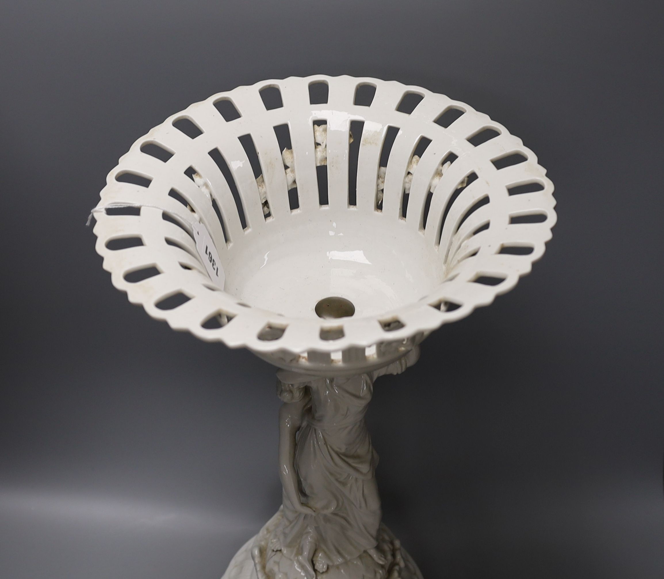 A Continental white glazed porcelain centrepiece bowl modelled with two maidens - 47cm tall